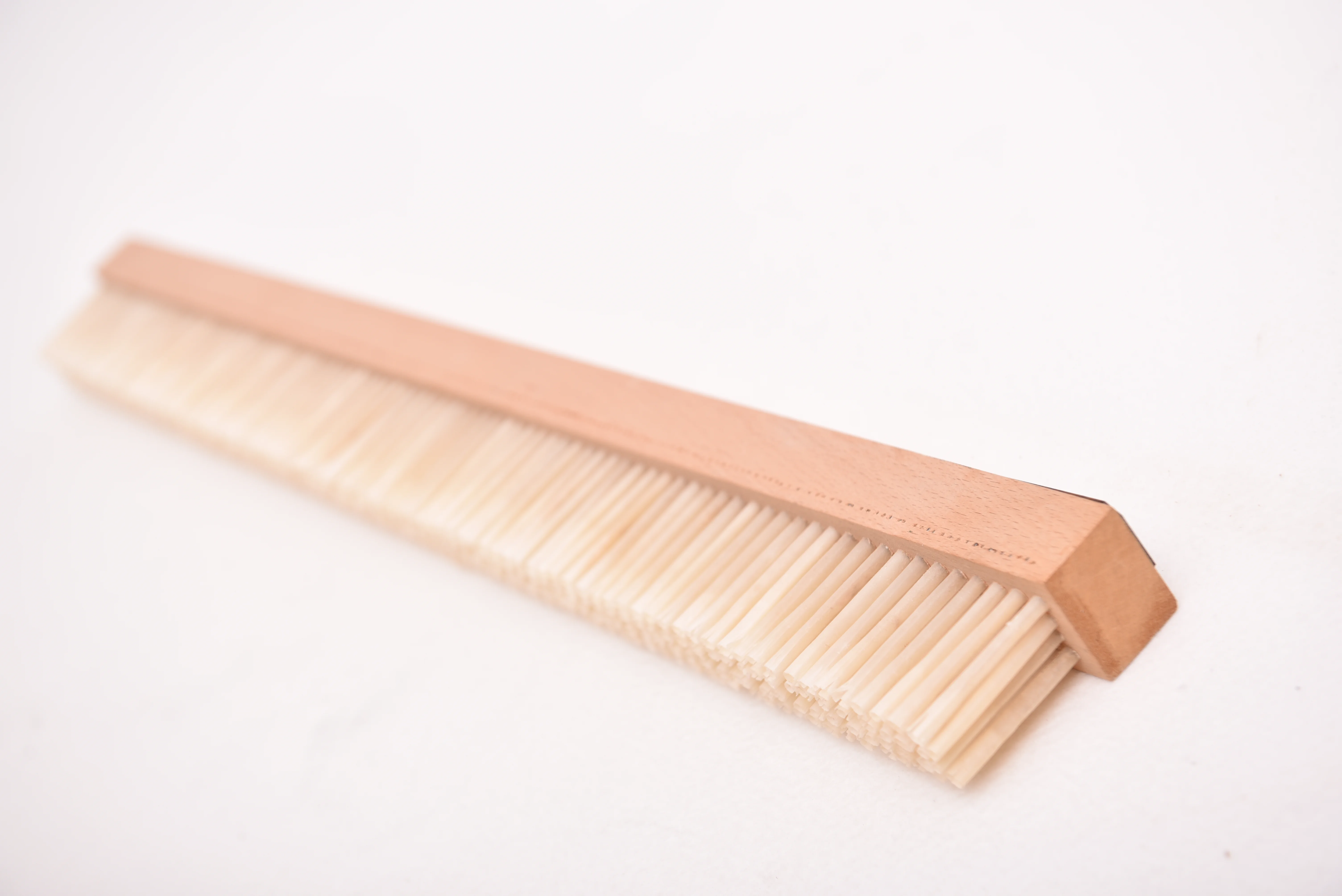 Goose feather brushes for roller mills